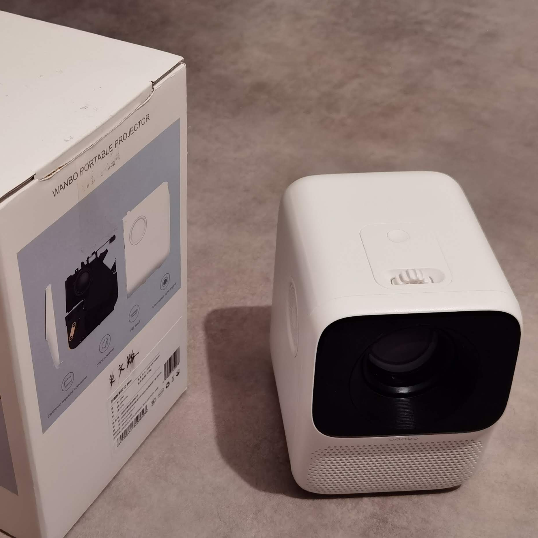 Wanbo T2 Max Portable Projector next to its packaging box