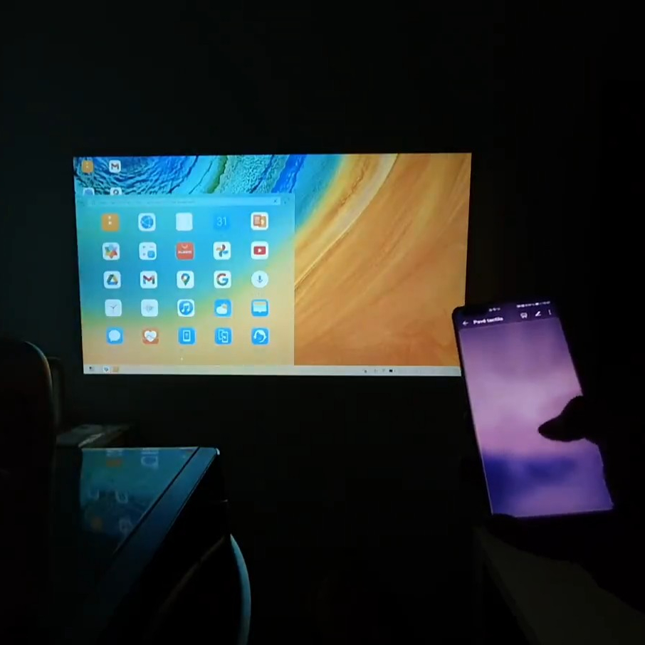 Huawei P40 Pro screen wirelessly mirrored to Wanbo T2 Max projector using Miracast, displaying desktop mode