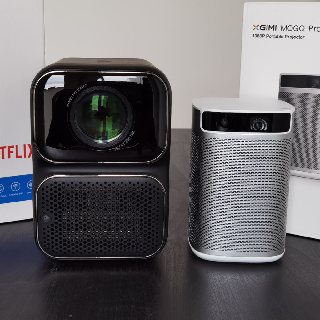 Wanbo TT vs XGIMI Mogo Pro - Front View of the Portable Projector with boxes