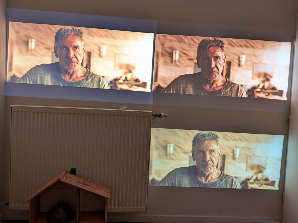Scene from Blade Runner 2049 — Left: Samsung Freestyle | Top-right: Nebula Capsule 3 | Bottom-right: Xming Episode One